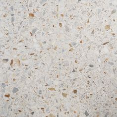 an image of white marble with brown and grey speckles on the top surface