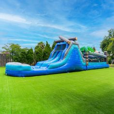 an inflatable water slide is on the lawn