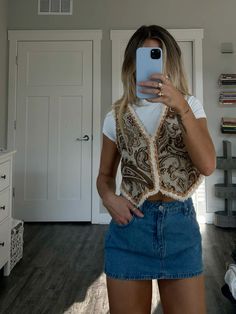 #vest #denimskirt #falloutfitsforwomen Vests With Skirts, Patterned Vest Outfit, Tapestry Vest Outfit, Western Vest Outfit, Fuzzy Vest Outfit, Sleeveless Vest Outfit, Fall Vest Outfits, Denim Mini Skirt Outfit, Faux Fur Outfit