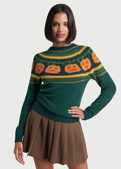 Give them something to talk about this Halloween ! A quirky, festive pick from our ModCloth namesake label, this Fair Isle sweater will make any outfit absolutely ‘gord-geous’ with its exclusive pattern at the yoke of bold orange jack-o-lantern pumpkin motifs attached to green vines, framed by yellow and orange zig-zags, with polka-dots scattered all over. Made from a super soft, black cotton knit, this pullover sweater is a classic crew neck cut in an easy fit that is ideal for cool weather layering. 100% Cotton Fabric provides stretch Fits true-to-size Imported Model Measurements: Height: 5'8"/173cm Bust: 34/86cm Waist: 25 1/2"/65cm Hip: 36"/91cm Dress: 2 US / 6 AU / XS | ModCloth Give 'Em Pumpkin To Talk About Fair Isle Sweater in Green 60s Mod Fashion, Chevron Outfit, Something To Talk About, Green Vines, Halloween Clothing, Statement Outfit, 70s Outfits, 1970s Fashion, Fair Isle Sweater