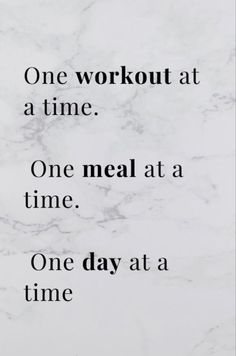 a marble wall with the words one workout at a time, one meal at a time