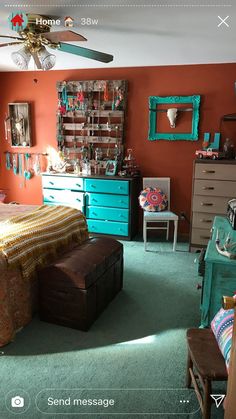 a bedroom with orange walls and green carpet