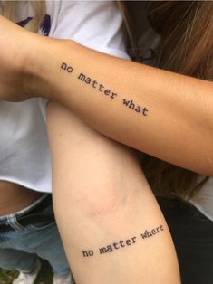 two people with tattoos on their arms that say no matter what they are doing,