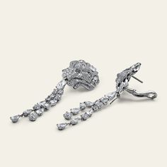 Chanel Lion Royal Earrings, Medium Version, White Gold, Diamonds Details 18k White Gold 1 Pear Cut Diamond .75cts (E-VVS2) 1 Pear Cut Diamond .75cts (F-IF) 28 Fancy Cut Diamonds 6.77cts (F+ - VVS+) 472 Round-Cut Diamonds 4.03cts (F-G - VVS1/2) *Comes with original box and certificate. *These Chanel earrings are unique. UK retail £175,000 with vat. UK retail £145,000 without vat.Product Number: J60875 Luxury Hand Set Round Diamond Earrings, Luxury Platinum Baguette Diamond Earrings, Luxury Diamond White Platinum Cluster Earrings, Luxury Platinum Diamond Earrings With Baguette Diamonds, Luxury Platinum Cluster Earrings In Diamond White, Luxury Platinum Dangle Diamond Earrings, Luxury White Gold Cluster Drop Earrings, Luxury Formal Diamond Earrings With Brilliant Cut, Luxury Diamond Earrings With Brilliant Cut For Formal Events