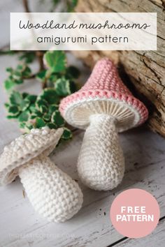 two crocheted mushrooms sitting next to each other on top of a wooden table