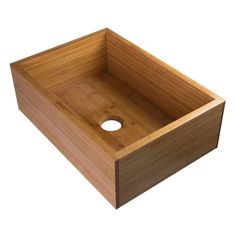 a square wooden sink with a hole in the middle and no faucet on top