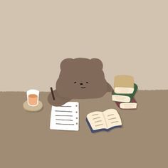 a brown bear sitting next to a pile of books