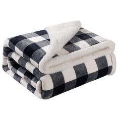 three black and white checkered blankets stacked on top of each other