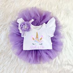 ♥ Unicorn Tutu Set ♥  This sweet tutu outfit is sure to be a special addition to your little one's wardrobe. It's perfect for cake smash photos! Bodysuit has 3 snap closure. The headband is soft and stretchy. Your choice of a flutter sleeve bodysuit, Gerber Onesie®, or Carter's Bodysuit. I make these shirts using a professional textile printer and commercial heat press equipment. Made to last, wear after adorable wear:) The design in dyed right into the fabric so it's very soft to the touch and Cute Purple Tutu Dress For Birthday, Purple Cute Tutu Dress For Birthday, Cute Tutu Dress With Unicorn Print For Birthday, Cute Unicorn Print Tutu Dress For Birthdays, Cute Unicorn Print Tutu Dress For Birthday, Unicorn Birthday Tutu Outfit, Cute Purple Tutu Dress For First Birthday, Purple Cute Tutu Dress For First Birthday, Purple Tutu Baby 1st Birthdays