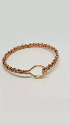 "This is a beautiful handmade piece created by Mimi.  This bracelet is weaved with a 16 and 26 gauge  bare copper wire .  The circumference is approximately 2.25\". The length of the bracelet is about 6.5\".  Copper is great for arthritis. Copper has a natural oxidation that occurs over time. It really gives it an antique or vintage look. If you want a brighter look you can clean it with a simple solution of lemon and salt. Then rinse well in water. The closure is hook and eye Perfect as a gift or a treat for yourself" Rose Gold Wire-wrapped Copper Bracelets, Bohemian Rose Gold Wire Wrapped Bracelets, Copper Bracelets With Lobster Clasp For Gift, Handmade Copper Wire Bangle Bracelet, Copper Wire Wrapped Bangle Bracelet, Copper Wire Wrapped Bangle, Handmade Copper Braided Bangle Bracelet, Bronze Wire Wrapped Copper Bracelets, Hook And Eye