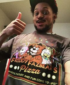 a man wearing a t - shirt that says frody fazer's pizza