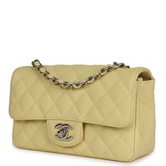 This Mini Classic Rectangular Flap Bag is in Yellow Caviar with silver tone hardware, tonal stitching, front flap with CC turnlock closure, halfmoon back pocket, and an interwoven silver tone chainlink and yellow leather strap The interior is lined in Yellow leather and features a small zip pocket with Chanel pull and slip pocket underneath on the rear wall. Collection: 25-series (18C)Origin: ItalyCondition: ; Mint- This bag retains it shape. No plastic on hardware so very minor hairline scratch Chanel Mini Rectangular, Chanel Box, Mini Classic, Chanel Mini, Yellow Leather, Classic Flap, Fendi Bags, Flap Bag, Handbag Backpack