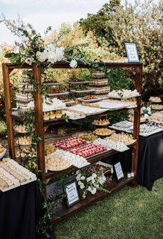 an outdoor buffet with lots of food on it