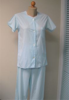 "Vintage baby blue seersucker pajamas are lightweight and perfect for summer.  Top has four button front closure, short sleeves, back yoke, front pocket and V neck with crochet lace trim.  Pants have fitted front waistband with elastic back and placket with one button closure.  Finished French seams throughout.  Very good condition.  Please see measurements below!  -   -   - DETAILS & MEASUREMENTS -  -  -  Label/maker - Lady Nobelt by Formfit Rogers Size/fit - 14 Condition - very good Top: Shoul Light Blue Cotton Short Sleeve Sleepwear, Blue Short Sleeve Sets For Daywear, Light Blue Short Sleeve Sleep Sets, Light Blue Short-sleeve Sleepwear, Blue Pajamas, Summer Pjs, Label Maker, Crochet Lace Trim, How To Hem Pants