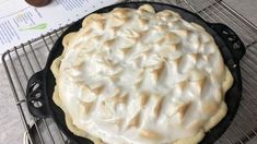 a pie sitting on top of a metal rack