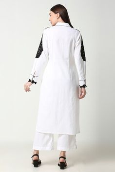 Black and white collared long tunic with cutwork details. Paired with a white pant with cutwork at the sides. - Aza Fashions White Pant, Straight Kurta, Pant Sets, Embroidered Tunic, Long Tunic, Set Women, Cut Work, Pant Set, White Pants