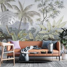 a living room filled with furniture and wallpaper covered in tropical plants on the walls