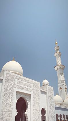 an ornate white building with two towers