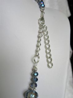 "Pale blue gray crystals were used to make this necklace. The largest is 1\" x 3/4\" x 1/4\" thick. The smallest are 4x6mm. The spacers are silver plated rondelles. A 3\" extender is included. The earrings, made with slightly more than 1/2 inch flat rounds, dangle 1\" from the loops of the silver plated ear wires. All metals are silver plated. This set will be slipped into an organza bag and shipped in a bubble mailer." Silver Adjustable Rhinestone Costume Necklace, Adjustable Silver Rhinestone Costume Necklace, Silver Metal Crystal Necklace With Lobster Clasp, Silver Czech Glass Dangle Necklaces, Silver Beaded Rhinestone Necklace For Jewelry Making, Silver Dangle Necklace With Czech Glass, Adjustable Faceted Silver Crystal Necklace, Silver Crystal Dangle Necklaces With Adjustable Chain, Silver Crystal Beaded Necklaces For Jewelry Making