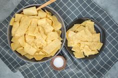 two pans filled with food sitting on top of a table