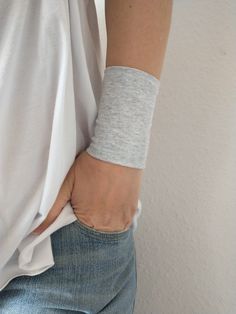 "Wide fabric wrist cuff bracelet in gray- visit my shop for more colors. Handbands, wrist cuffs, wrist wraps - visit my shop for more color matching accessories. When ordering the Set of 2, 3 or 4 - Please specify in the \"Notes\" when purchasing, which color combination you would like. *Handmade with love and care in a smoke free home *Every wrist cuff is sewn by me *Double layered *Ideal for covering wrist tattoos *Stretchy and soft jersey *Fabulous accessory for your outfit *Goes well with ev Wrist Tattoo Cover Up, Wrist Wraps, Sailor Knots, Tattoo Cover Up, Tattoo Cover, Tattoo Cover-up, Wrist Tattoo, Wrist Wrap, Wrist Cuffs