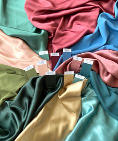 several different colors of satin fabric on top of each other