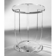 a clear glass vase sitting on top of a table