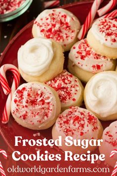 frosted sugar cookies on a red plate with candy canes