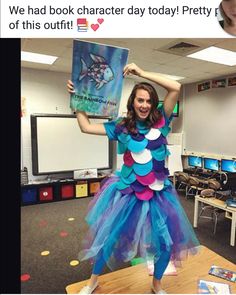 a girl dressed as a mermaid holding a book in front of her face and text that reads, we had book character day today prettyly