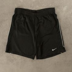 Men's Vintage Nike Sport Shorts  + Closure: Drawstring  + Colour: Black  + Size Label States: Medium  + Actual measurements (inches): Medium  + Measurements (Inches): Hem = 12, Rise = 13  Please note that all vintage items have been previously worn, and may show some signs of previous wear. However, any significant damage will be photographed and/or stated in the items listing. Please note that damage to the inside may not always be photographed or listed. Sport Nike, Nike Short, Nike Vintage, Shorts Nike, Nike Sports, Size Label, Vintage Nike, Sport Shorts, Cargo Shorts