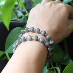 Elevate your spirit and style with our smooth Labradorite wrist mala bracelet. Made of beautiful, natural Labradorite beads, this bracelet is handcrafted with care to bring you the powerful energy of inner strength, serendipity, and positivity. The smooth beads allow for comfortable wear and a striking appearance that complements any outfit. Labradorite's unique iridescence only adds to the beauty of this bracelet, making it a must-have for anyone looking to bring a little magic into their lives Healing Labradorite Beaded Bracelets With 8mm Beads, Gray Hand-strung Bracelets With Round Beads, Gray Round Beads Spiritual Bracelet, Spiritual Labradorite Beaded Bracelets As Gift, Gray Spiritual Jewelry With Gemstone Beads, Adjustable Labradorite Spiritual Beaded Bracelets, Adjustable Labradorite Beaded Bracelets For Spiritual Wear, Adjustable Labradorite Beaded Bracelets For Spiritual Healing, Gray Round Beads Spiritual Jewelry