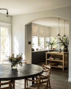 a dining room table and some chairs in a room