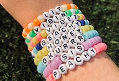 a person wearing a bracelet with words written on it