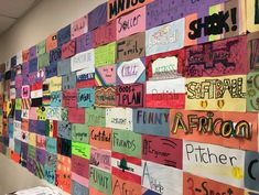 a wall covered in lots of different types of colorful signs and words that read i love africa