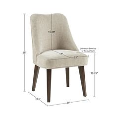 the measurements for an upholstered dining chair with wood legs and backrests