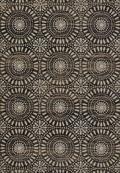 a black and white rug with circular designs on it