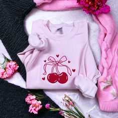 This cozy unisex sweatshirt is embroidered with acute and trendy Bow with Cherrys. The perfect fall sweater!  All sweatshirts are Gildan 18000 Unisex sweatshirts. They are a cozy soft fabric made from a soft cotton/poly blend with no itchy side seams, this is sure to become a staple. Sizing details:  * All sweatshirts are unisex sizing, please refer to the size chart in the listing photographs to determine your size.  * If you are not sure what size to order, you can measure a sweatshirt you alr Trendy Bows, Cute Bows, Fall Sweaters, Unisex Sweatshirt, Clothing Items, Soft Fabrics, Crew Neck Sweatshirt, Gifts For Her, Sweatshirts Hoodie