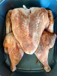 a whole chicken sitting in an air fryer