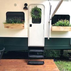 the interior of a recreational vehicle with plants growing out of it's window boxes