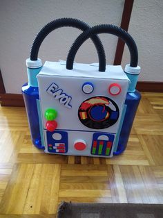 an electronic toy bag sitting on top of a hard wood floor