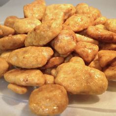 a pile of fried food sitting on top of a white plate