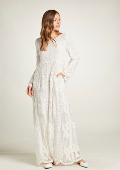 This adorable maxi dress is fully lined, a great modest wedding dress or an LDS temple-ready wedding dress. This boho style is very elegant, with a beautiful lace embroidery in cotton over tulle. It is comfortable and drapes nicely. It features a round neckline with fully lined sleeves and bodice. Long dress has 2 pockets in each side and no zipper just pull on quick and easy. The dress comes in sizes XS, S/M, M/L, XL and XXL Fabric: Tulle with embroidery 100% cotton Fully lined: 100% Polyester White Floral Embroidered Maxi Gown, White Maxi Length Gown With Floral Embroidery, White Maxi Gown With Floral Embroidery, White Floor-length Maxi Dress With Floral Embroidery, Wedding Maxi Dress With Lace Trim, Lace Trim Maxi Dress For Wedding, White Scalloped Lace Maxi Dress, Modest Lace Dress With Lace Sleeves, Wedding Gown With Delicate Lace Maxi Length