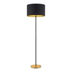 a black and gold floor lamp on a white background