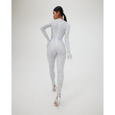 Price listed in USD. Silver printed spandex knit gloved catsuit with heel and toe opening. The glove portion at wrist has a button and loop opening to allow for the use of bare hands. (To complete this look the skirt is available for purchase) Sizing: XS, S, M, L, XL Sizing: XS: Bust: 30”-32” Waist: 23”-24”,Hips: 33”-35” S: Bust: 33”-34” Waist: 25”-26” Hips: 36”-37” M: Bust: 35”-36” Waist: 27”-28” Hips:38”-39” L: Bust : 37"-38" Waist: 29"-31" Hips: 40"-41" XL: Bust 39”-40” Waist : 32”-33” Hips: Winter Fitted Unitard, Party Stretch Elastane Unitard, Elastane Party Unitard, High Stretch Elastane Unitard For Party, High-stretch Elastane Unitard For Party, High Stretch Unitard For Night Out In Winter, High Stretch Unitard For Winter Night Out, White Stretch Unitard For Party, Stretch White Unitard For Parties