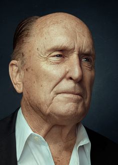 an older man with wrinkles on his face