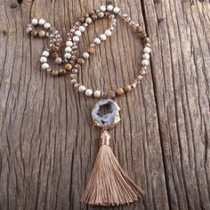 Bring a sophisticated Boho Chic touch to your summer outfit with our Precious Stone Boho Chic Beaded Necklace. A true embodiment of spiritual elegance, harmony and Bohème chic. Immerse yourself in sophistication with this elegant beaded necklace boasting a truly distinctive design. The pendant, created from a raw stone sample, is adorned with a delicate golden rim and a gracefully cascading tassel in a matching hue. Intricately beaded semi-precious stones are woven together to form this stunning Druzy Necklace, Beaded Pendant Necklace, Fashion Bohemian, Stone Gold, Jasper Beads, Semi Precious Stones, Necklaces For Women, Bohemian Jewelry, Beaded Pendant