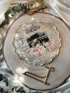 a plate with flowers on it sitting on top of a table