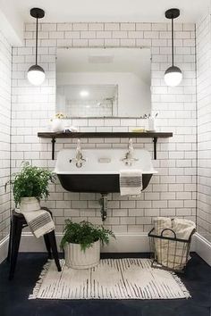 a bathroom with white brick walls and dark blue carpeted flooring, black accents