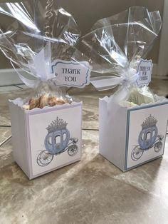 two small boxes with thank you bags on them