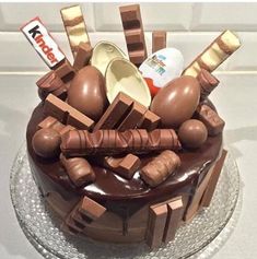 a cake with chocolate icing and decorations on top is displayed in the facebook page